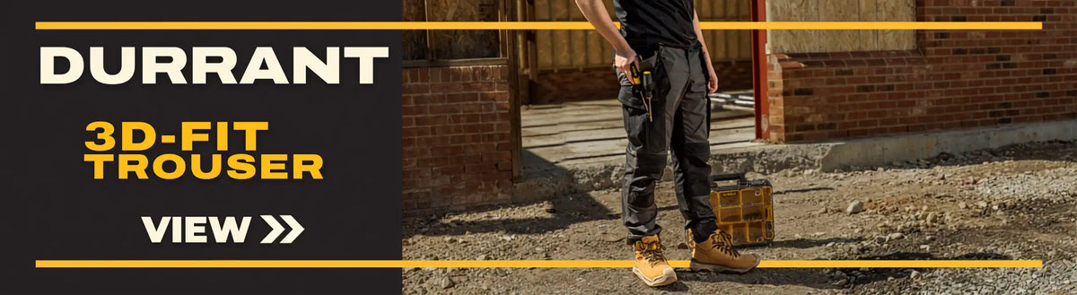 Promotional banner for Durrant 3D-Fit Trouser, featuring a man wearing dark gray work pants and tan work boots standing outdoors next to a brick wall, with a black sidebar on the left containing the text 'DURRANT', '3D-FIT TROUSER', and 'VIEW >>'.