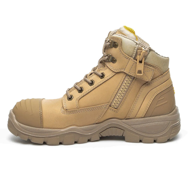 A tan mid-cut work boot with a side zipper, lace-up front, and protective toe cap, shown from a side profile on a white background.