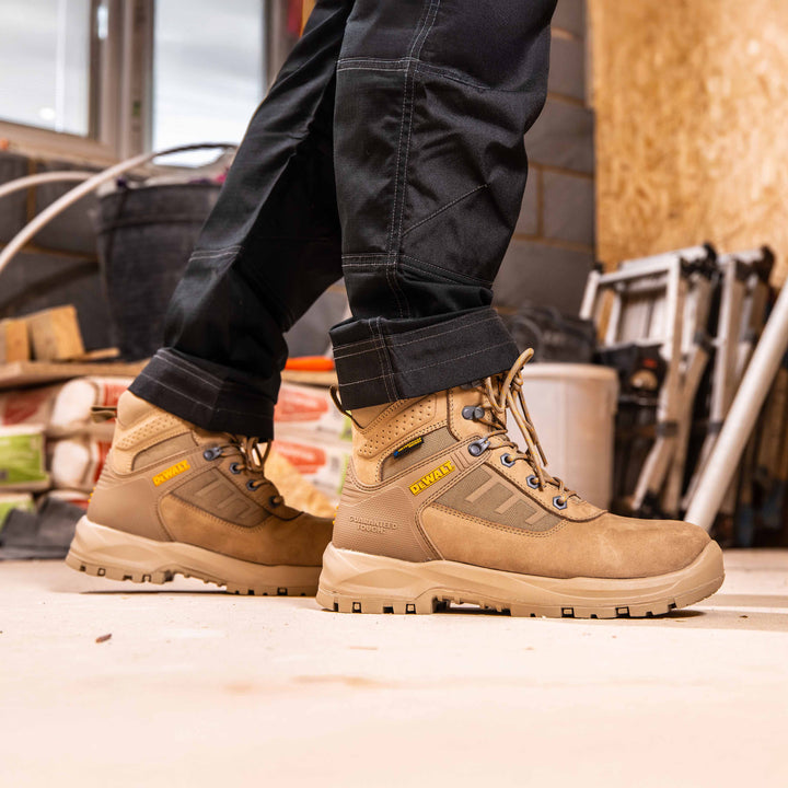 DEWALT Douglas Waterproof Steel Toe Safety Boot Stone Side View Facing Right On Model On Location