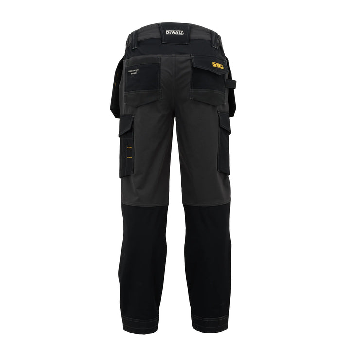 Black and dark gray DeWalt work pants shown from the back, featuring multiple utility pockets and a waist belt, on a solid white background.