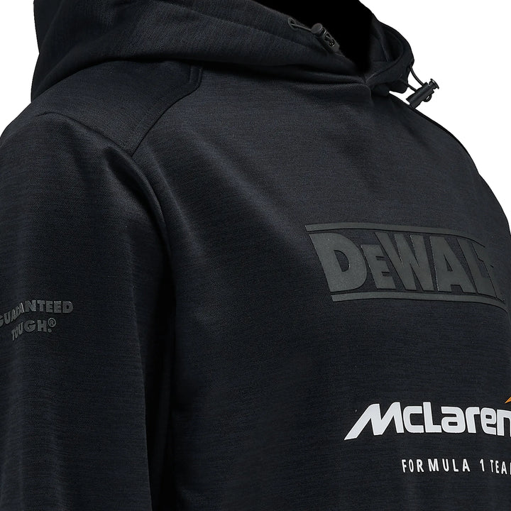 Close-up of a black hooded sweatshirt with a large tonal 'DEWALT' logo on the chest and a white 'McLaren Formula 1 Team' logo on the lower front, plus sleeve text, shown against a white background.