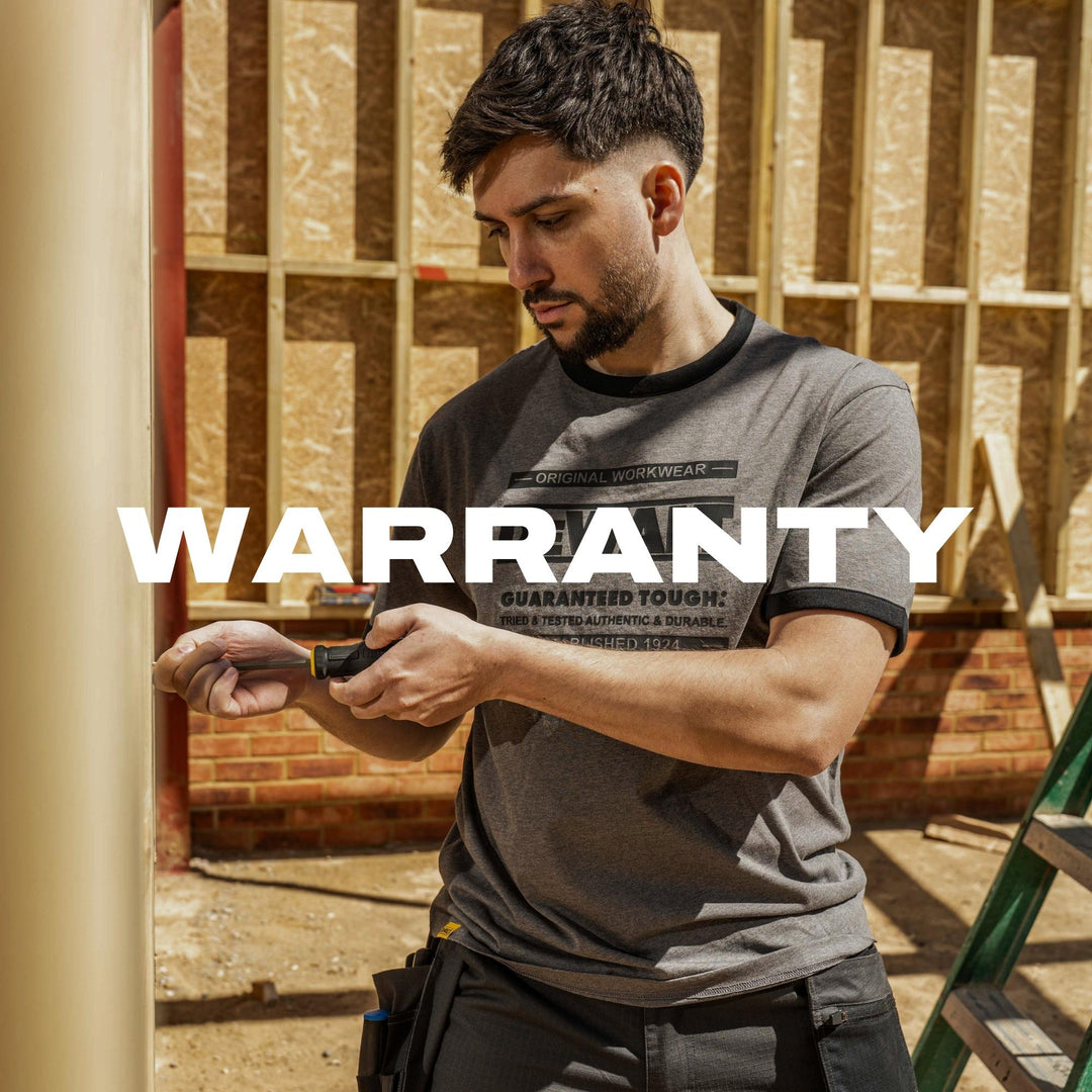 Man in work attire holding a tool with 'Warranty' text overlay in a construction setting