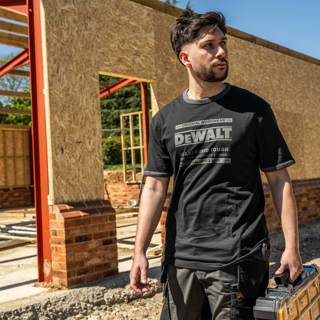 Man wearing a Dewalt t-shirt at a construction site